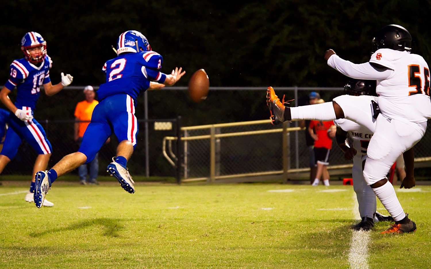 Ford Tannebaum blocks an extra point for Quitman Friday night against Queen City. The Bulldogs fell 65-13 in the homecoming game.